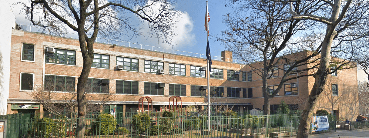 Exterior view of PS 58's building and garden from First Place